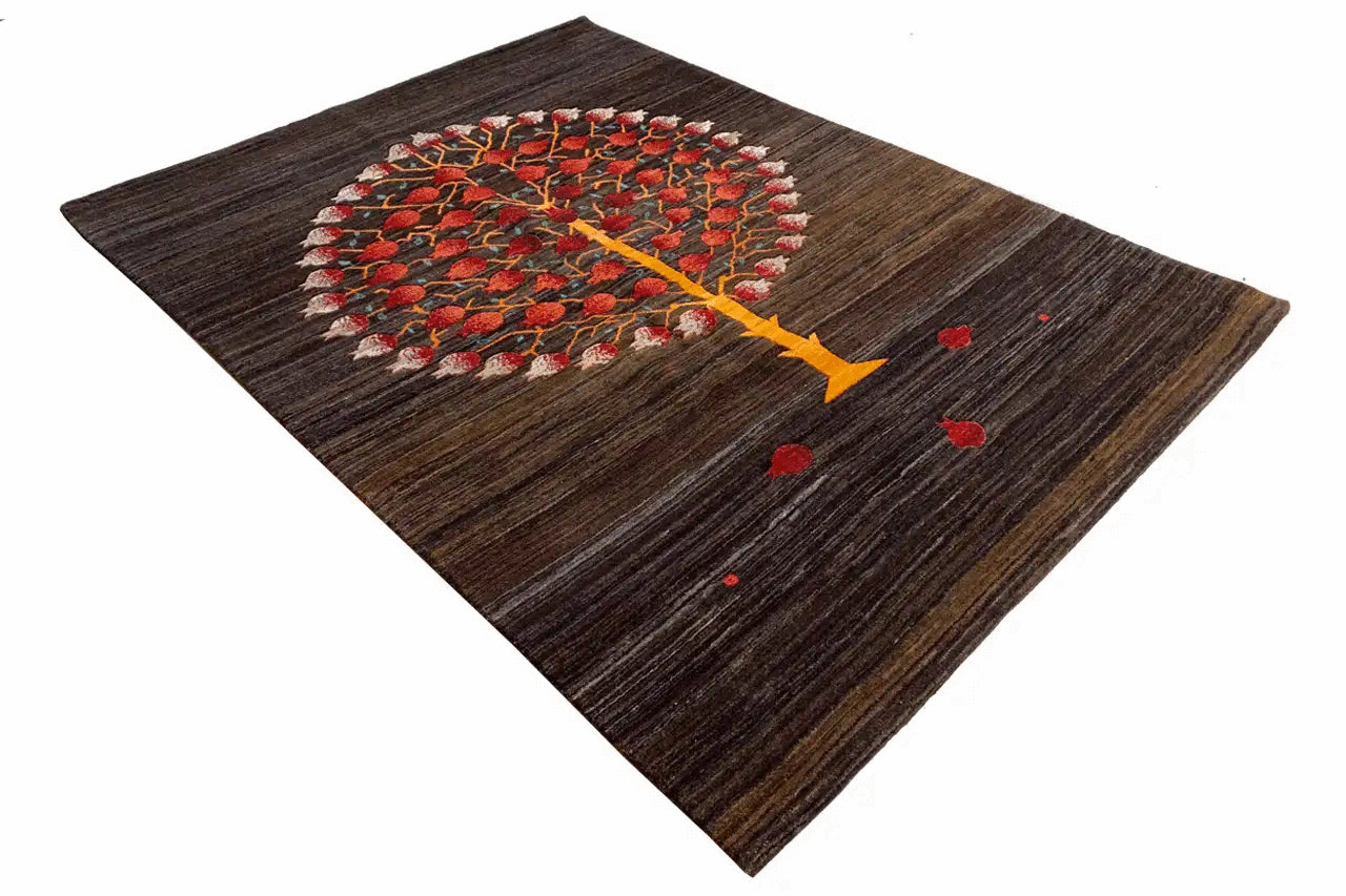 Lori gabbeh rug with a round tree motif, brown and red with yellow