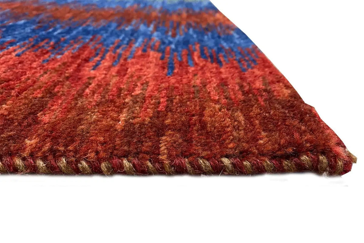 Gabbeh rug corner with a colorful zigzag pattern and fringes