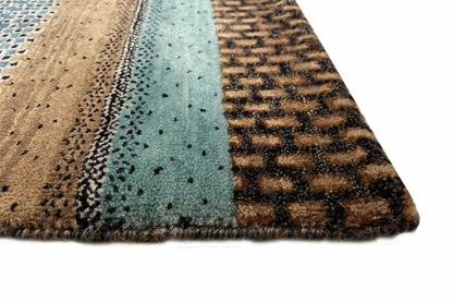 Gabbeh rug, close-up: patterned pile with short fringes along the edge, blue/brown