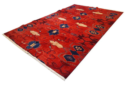Red rectangular rug with a blue and beige medallion pattern, 272x188 cm