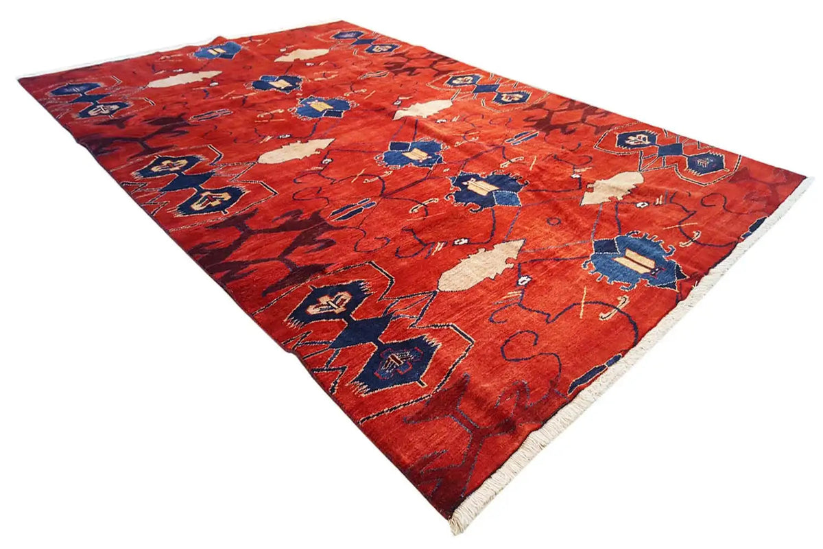 Red rectangular rug with a blue and beige pattern, 272x188 cm