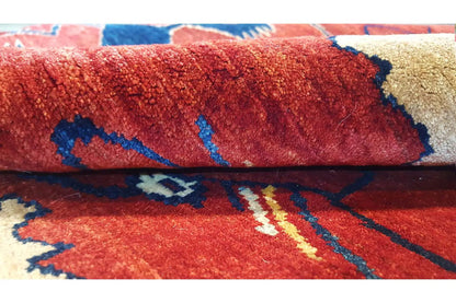 Close-up: red carpet with a blue pattern and beige accents