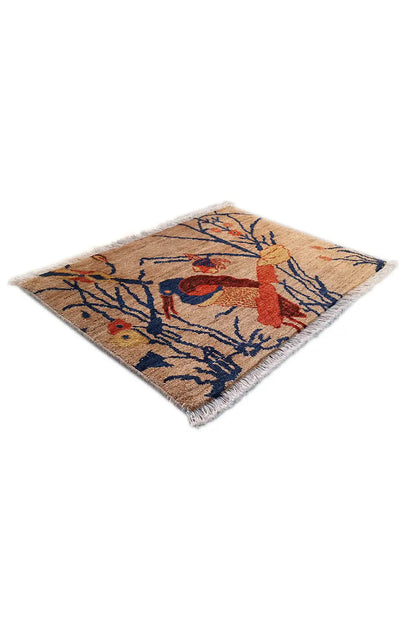 Rug 63x50 cm with a bird motif, blue branches and red accents, framed with straight edges