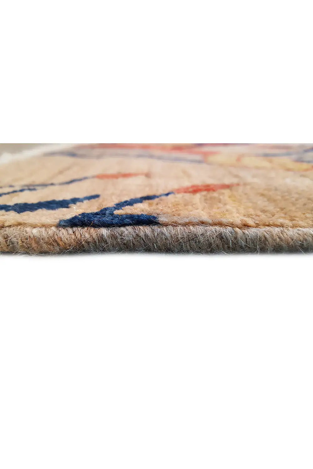 Carpet detail at the edge: dense pile with blue and red thread traces