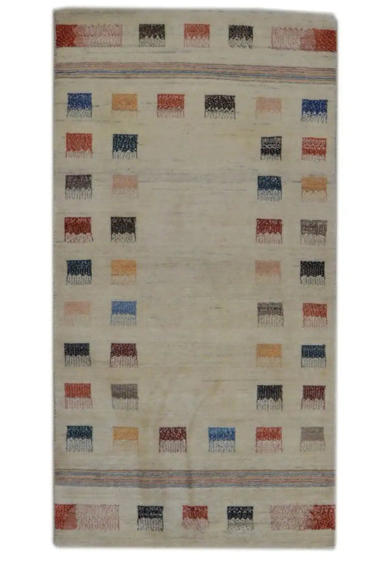 Rectangular Gabbeh rug, beige background with a colorful grid pattern of squares
