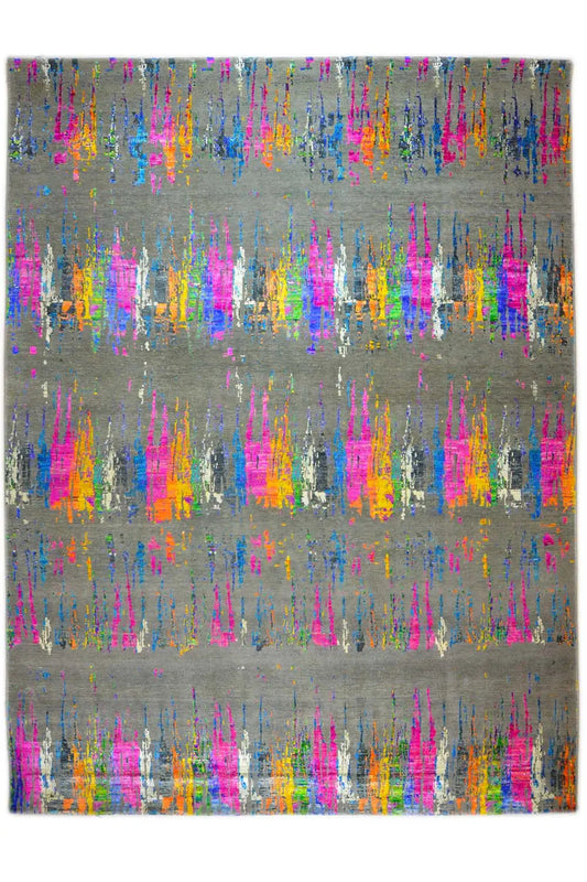 Rectangular designer rug with an abstract color-splatter pattern on a gray background, flat-woven.