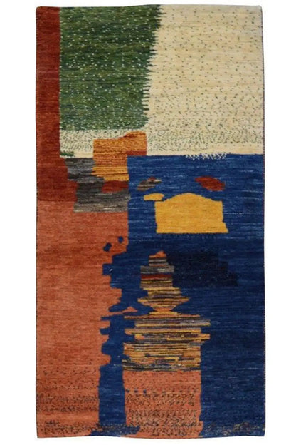 Gabbeh rug in portrait orientation: geometric patterns in blue, brown-orange, green, and beige