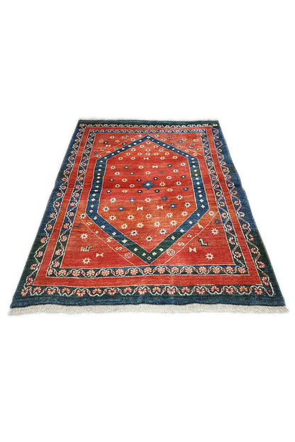 Flat-woven rug with a square medallion, dark blue border, and red inner field
