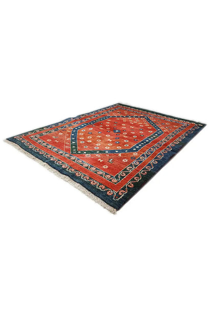 Carpet laid diagonally, red field with a blue border and ornamental pattern