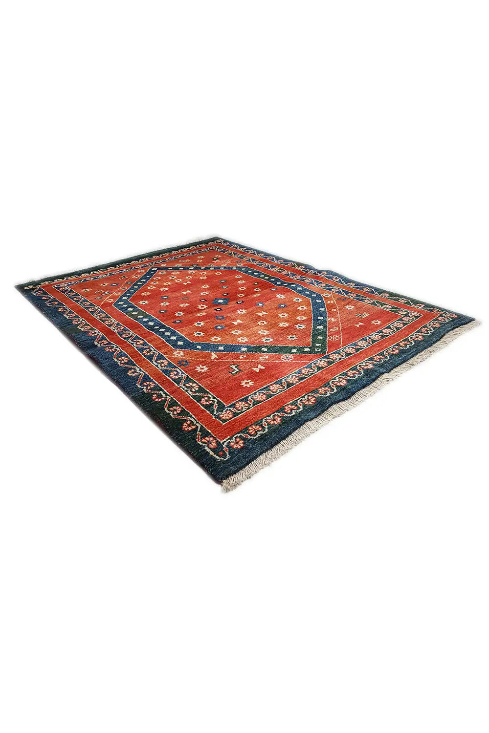 Carpet laid diagonally, red medallion in a blue-red patterned border