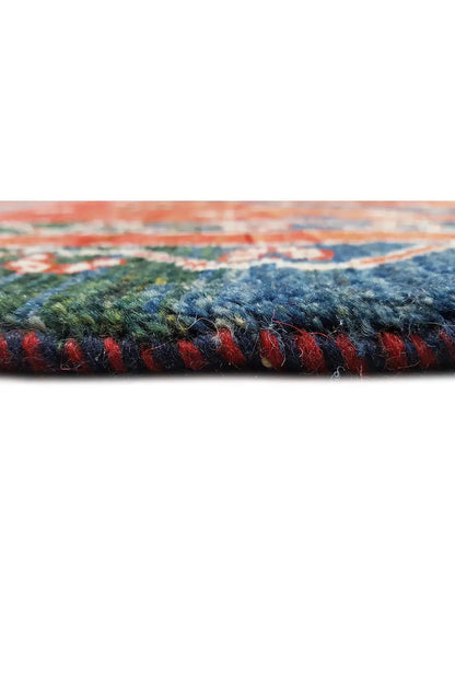 Rug with a dense pile surface, multicolored woven texture in side view
