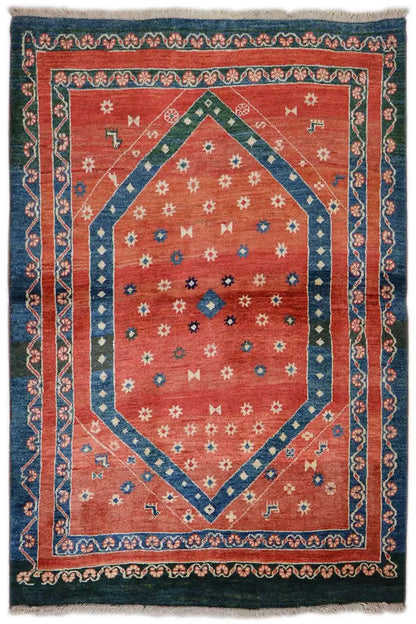 Carpet 150x111 cm with a red medallion and blue border, multicolored pattern