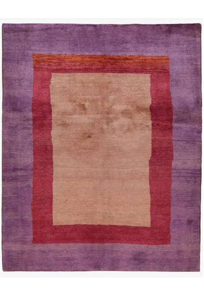 Gabbeh rug with a square pattern: purple field, red border, beige center.
