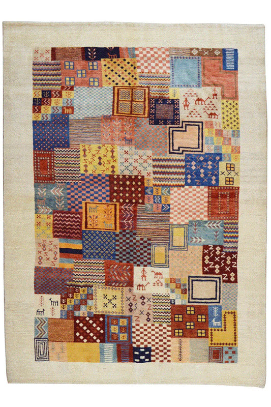 Rectangular “Lori” Gabbeh rug, patchwork motifs in yellow, blue, red, and beige