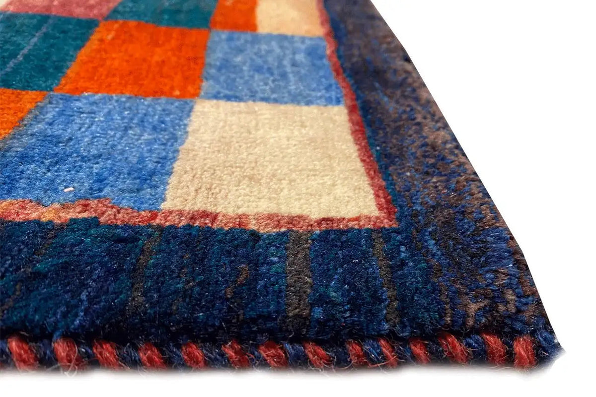 Gabbeh rug “Lori” detail: square color blocks, colored woven edges along the border