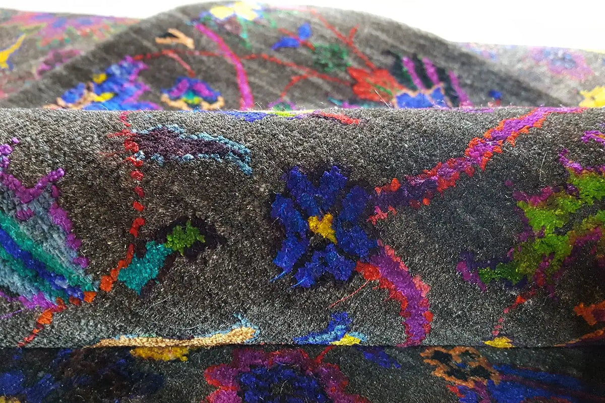 Silk sari with a bold ornamental pattern on a dark background