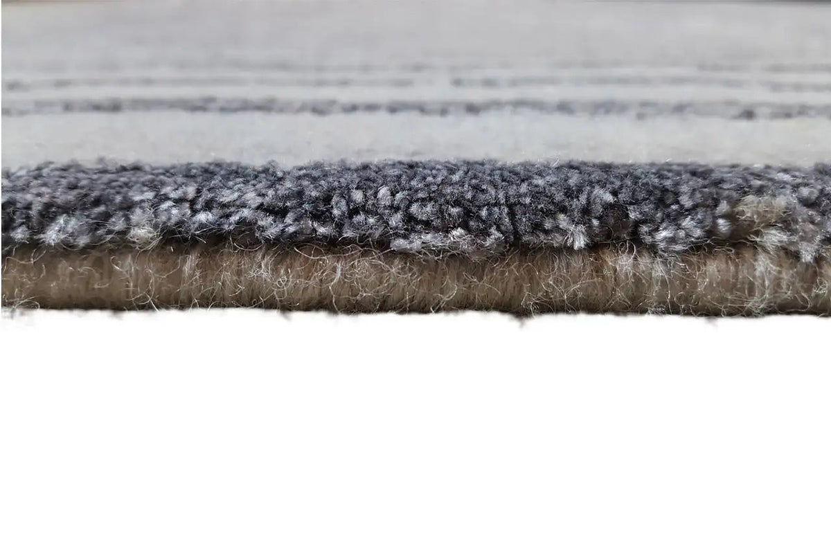 Carpet edge detail with gray and dark-bound pile