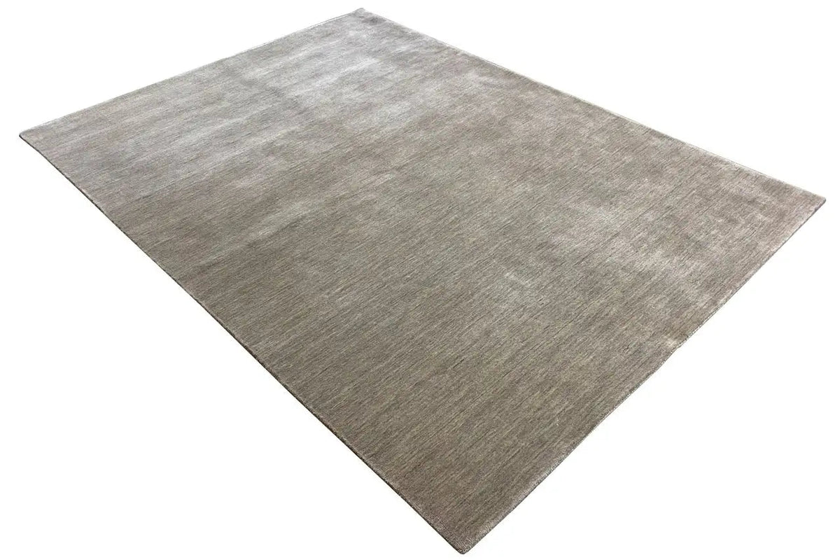 Light gray rectangular rug with a matte surface and subtle melange effect