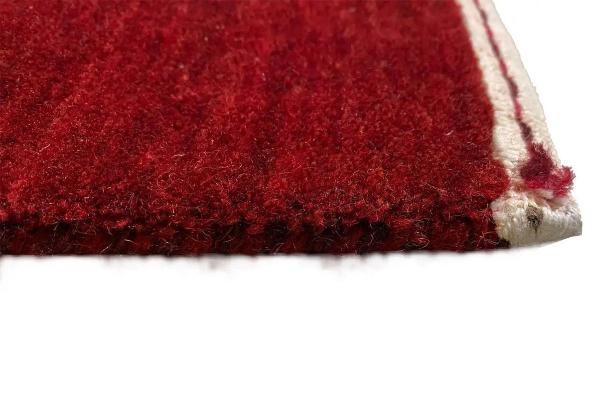 Gabbeh rug: red pile with a beige border, 242×172 cm