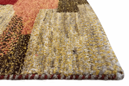 Close-up of a Gabbeh rug: multicolored virgin wool with fringes along the edge