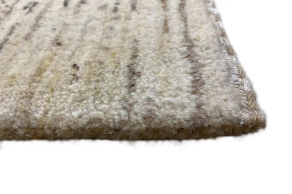 Gabbeh rug corner: short pile, light beige with dark mottled dots