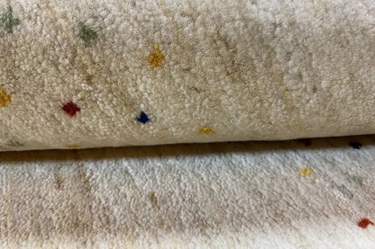 Gabbeh rug, detail of the pile with multicolored dots and a soft looped texture