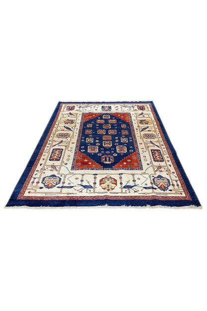 Oriental rug with a blue central medallion, cream-colored borders, and red accents