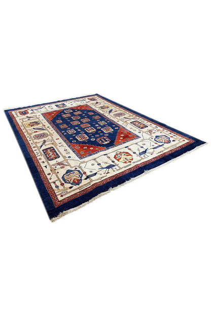 Oriental rug with a geometric medallion, cream-colored areas, and a blue border