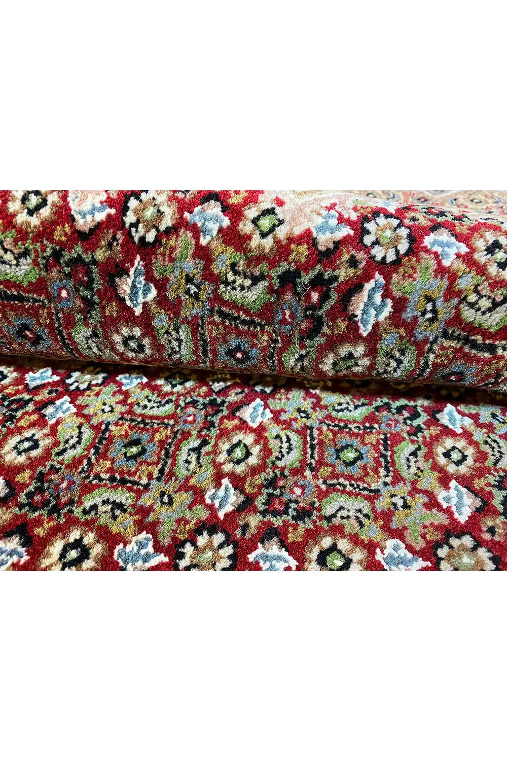 Indo Tabriz rug with a multicolored floral pattern, border, and dark edging