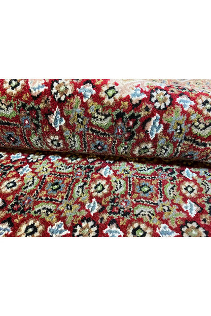 Indo Tabriz rug with a multicolored floral pattern, border, and dark edging