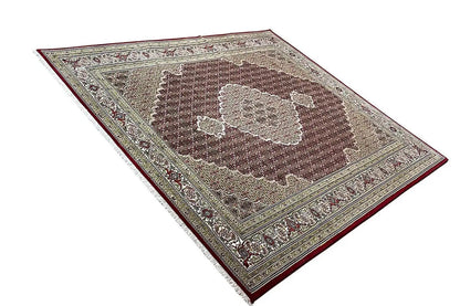 Indo Tabriz rug with brown field and light medallion, surrounding ornaments