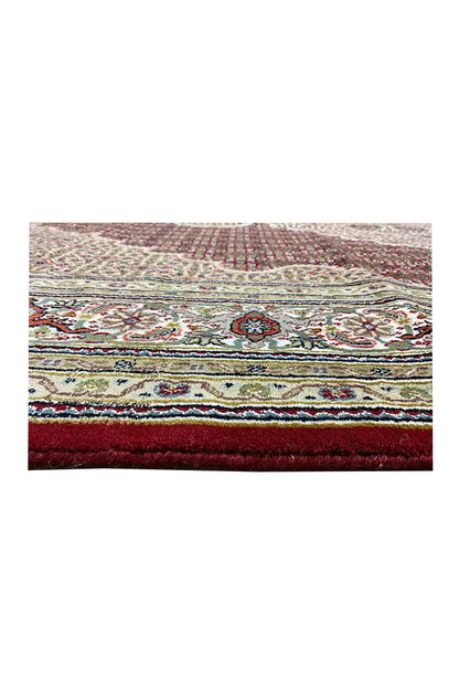 Indo Tabriz rug border detail with multicolored ornaments along the edge