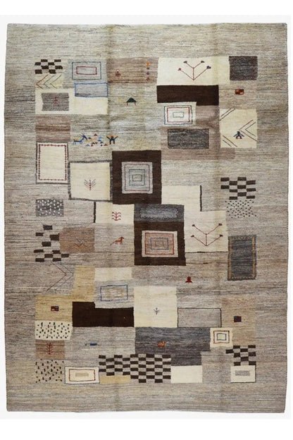 Rectangular Gabbeh rug with patchwork squares and small colorful accents
