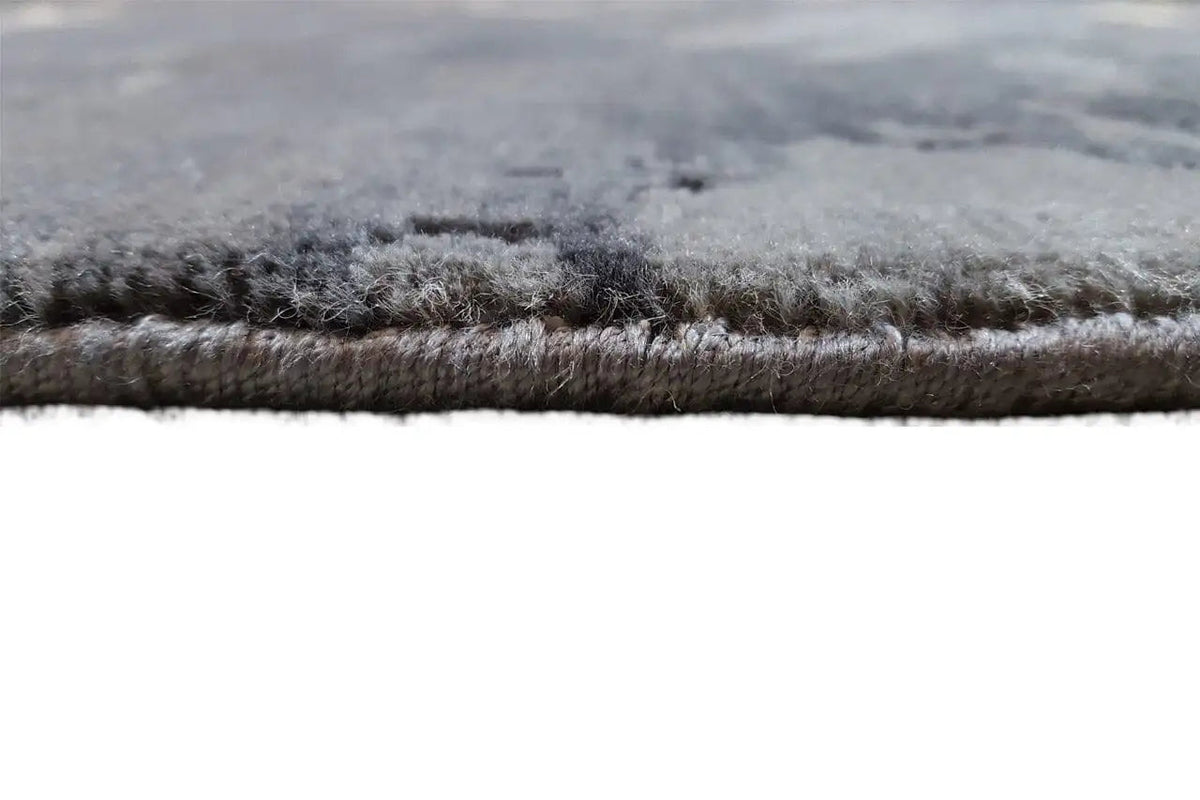 Carpet edge with dense, dark gray pile