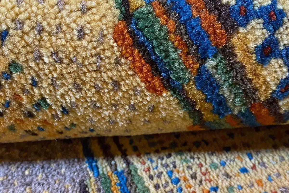 Gabbeh rug detail: textured pile surface with colorful stripes