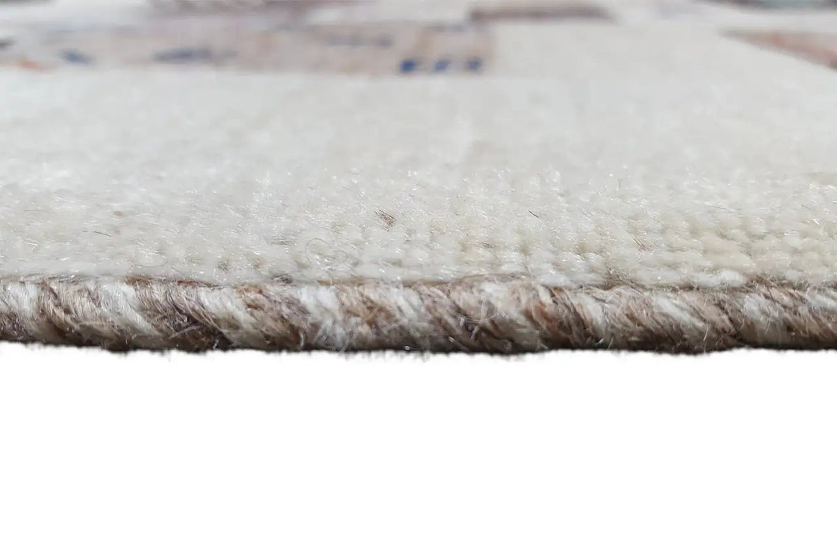 Gabbeh rug border with a short, dense pile and a light background.