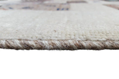 Gabbeh rug border with a short, dense pile and a light background.