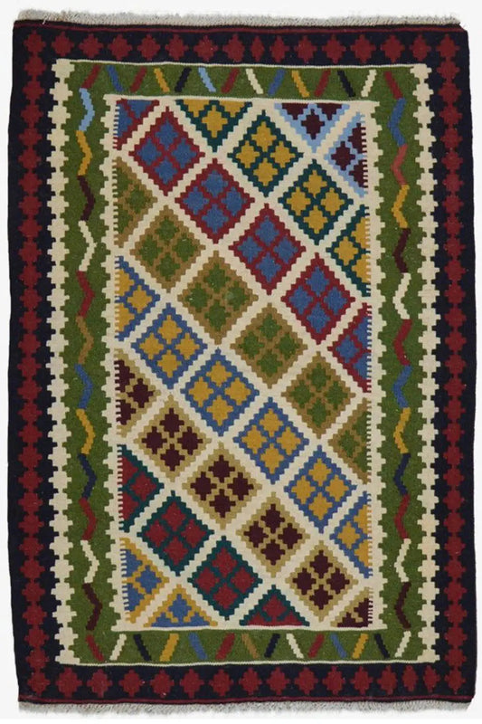 Kilim rug with a multicolored central motif and dark border trim