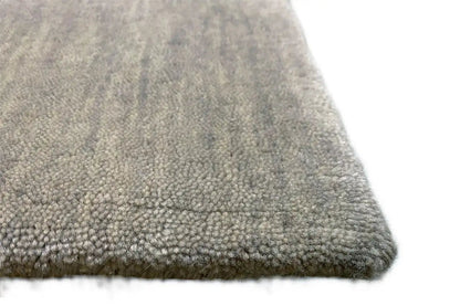 Close-up: light gray carpet with dense pile and a clean edge