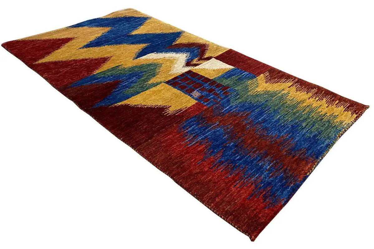 Gabbeh rug with a zigzag pattern, color combination of red, blue, yellow, and green