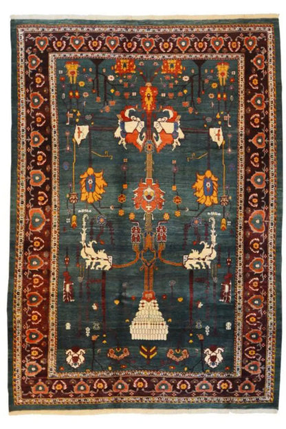 Classic Qashqai rug with a dark blue background, central medallion, and red decorative borders