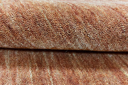 Close-up of the web structure of a brown Gabbeh rug with fine pattern lines