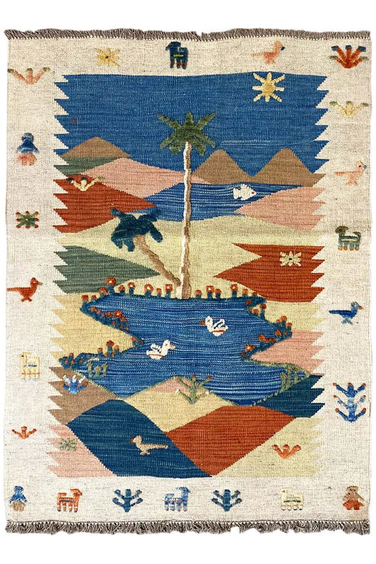Kilim rug, cream-colored with a blue central medallion, red mountains, stars, and ornamental figures