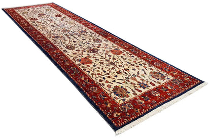 Oriental runner rug with a red border, cream-colored field, and floral pattern accents