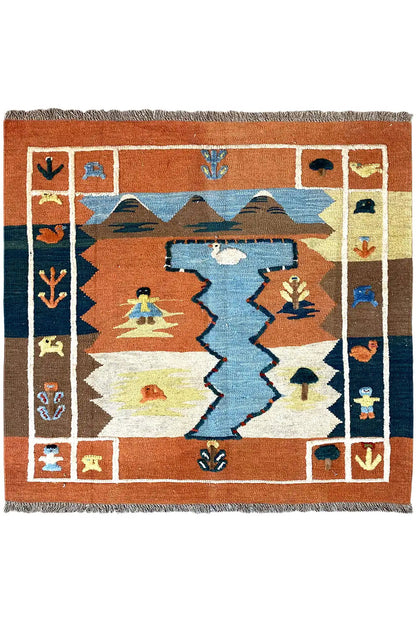 Kilim rug with a geometric pattern in terracotta, blue and cream, with fringes