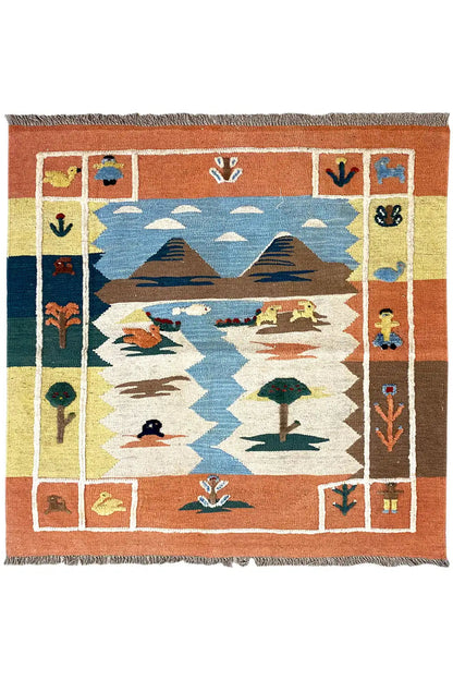 Kilim rug with animal and plant motifs, blue center, orange border, and fringes