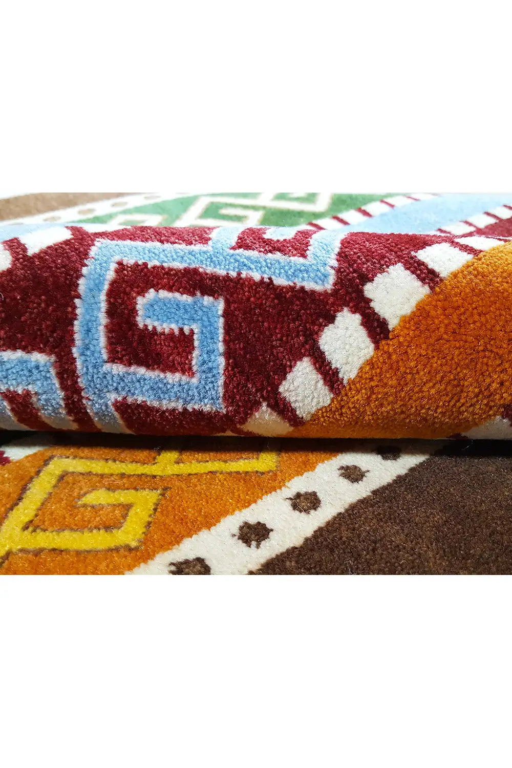 Gabbeh rug “Lori” close-up: soft pile with red and blue geometric motifs
