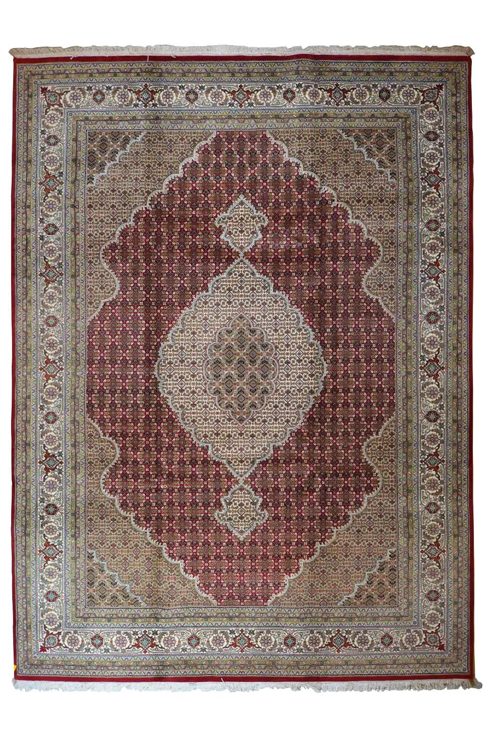 Indo Tabriz rug with central medallion, reddish-brown and beige pattern, and border