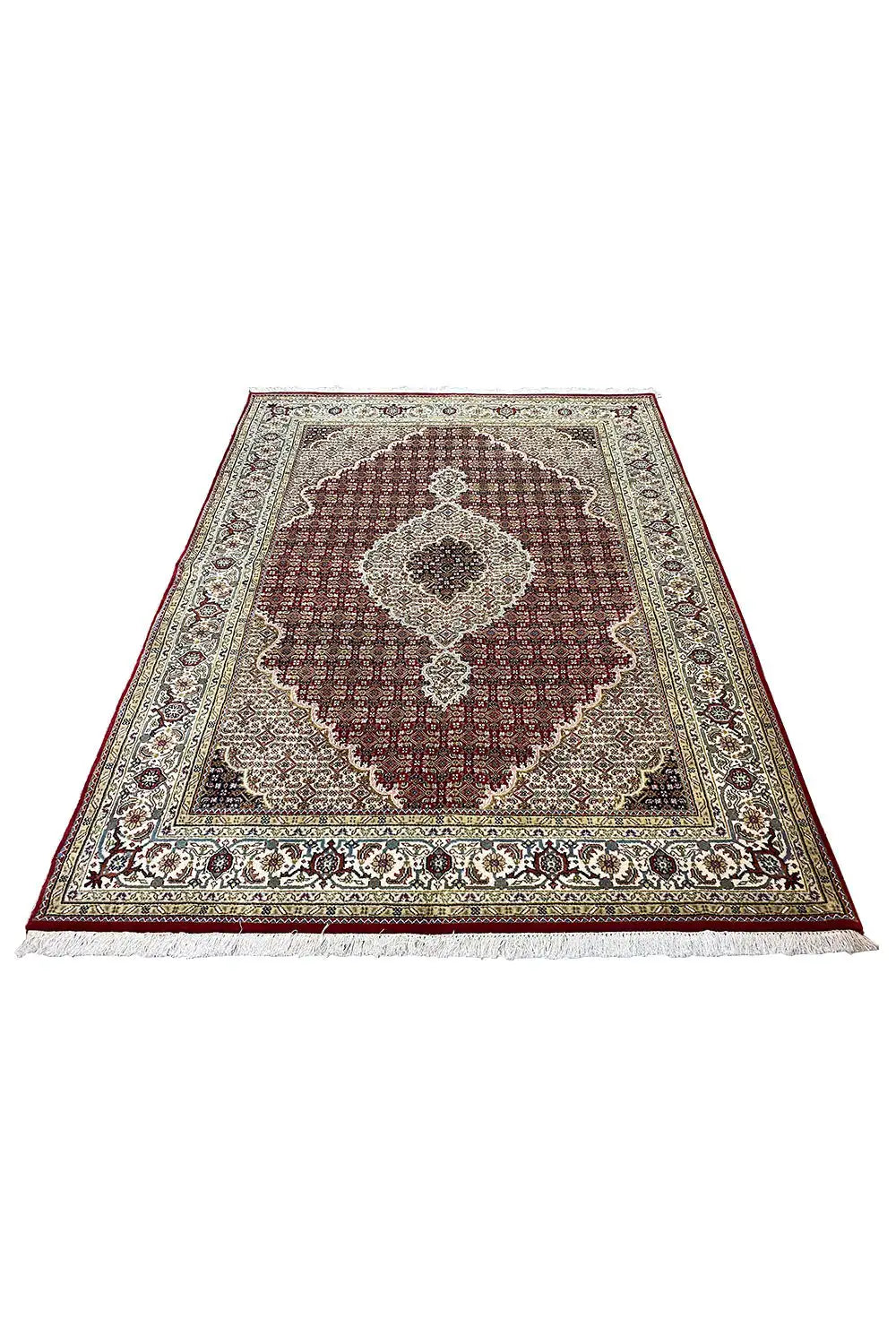 Oriental rug with a round medallion pattern in burgundy, beige, and dark brown