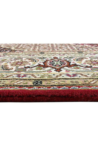 Carpet edge with a decorative border and fine pile texture, multicolored